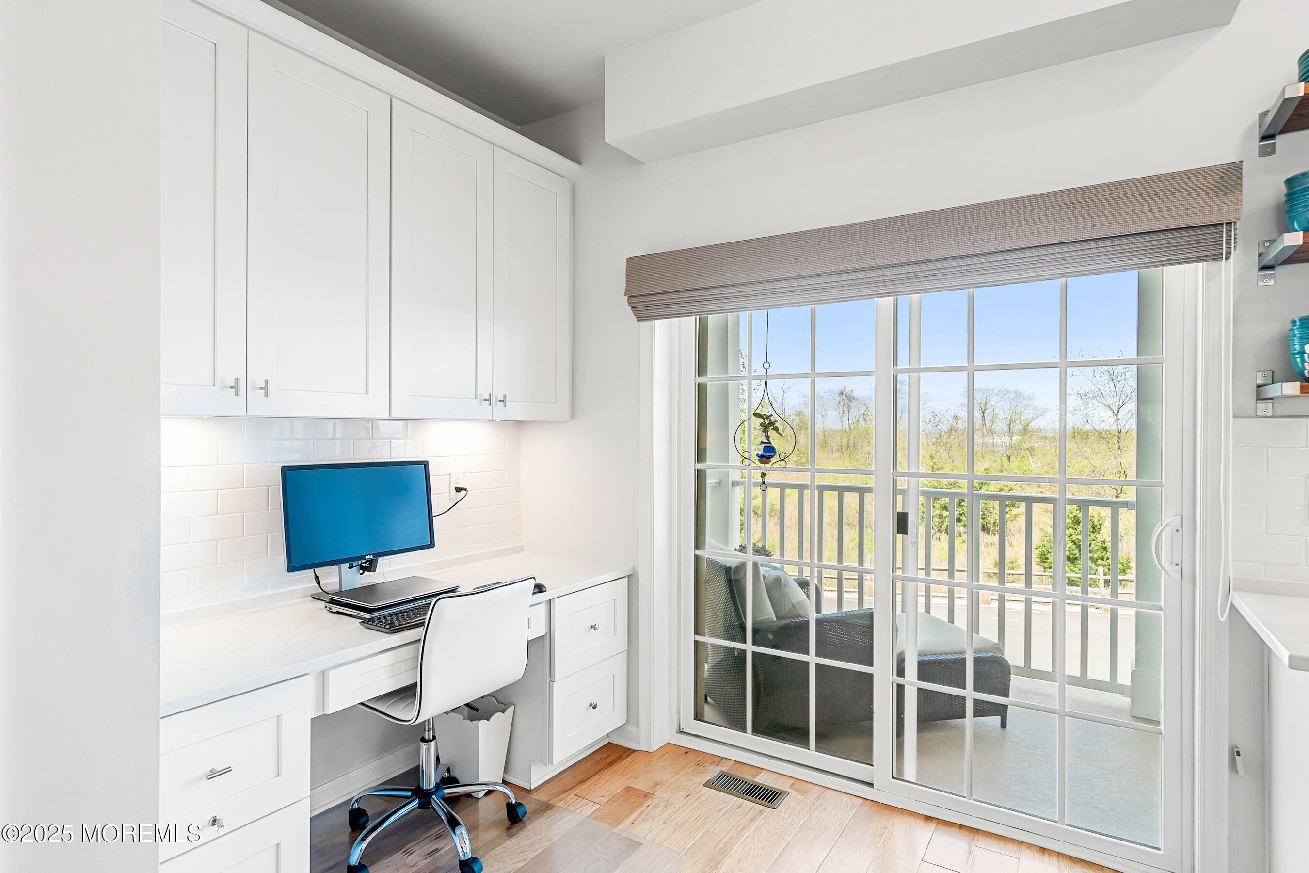 19 Lighthouse Point Road, Unit 504 Highlands, NJ 07732 - Photo 6 of 43 a view of a workspace with furniture and a window