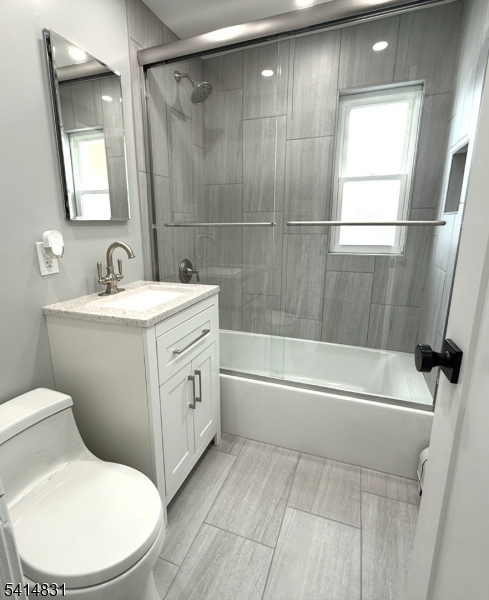 13A Garfield Park Edison, NJ 08837 - Photo 3 of 5 a bathroom with a sink toilet and shower