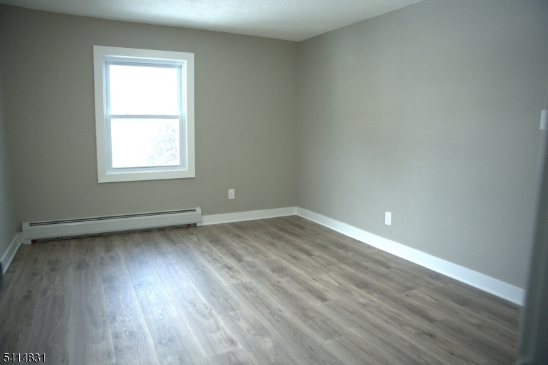 13A Garfield Park Edison, NJ 08837 - Photo 5 of 5 a view of a room with wooden floor and window
