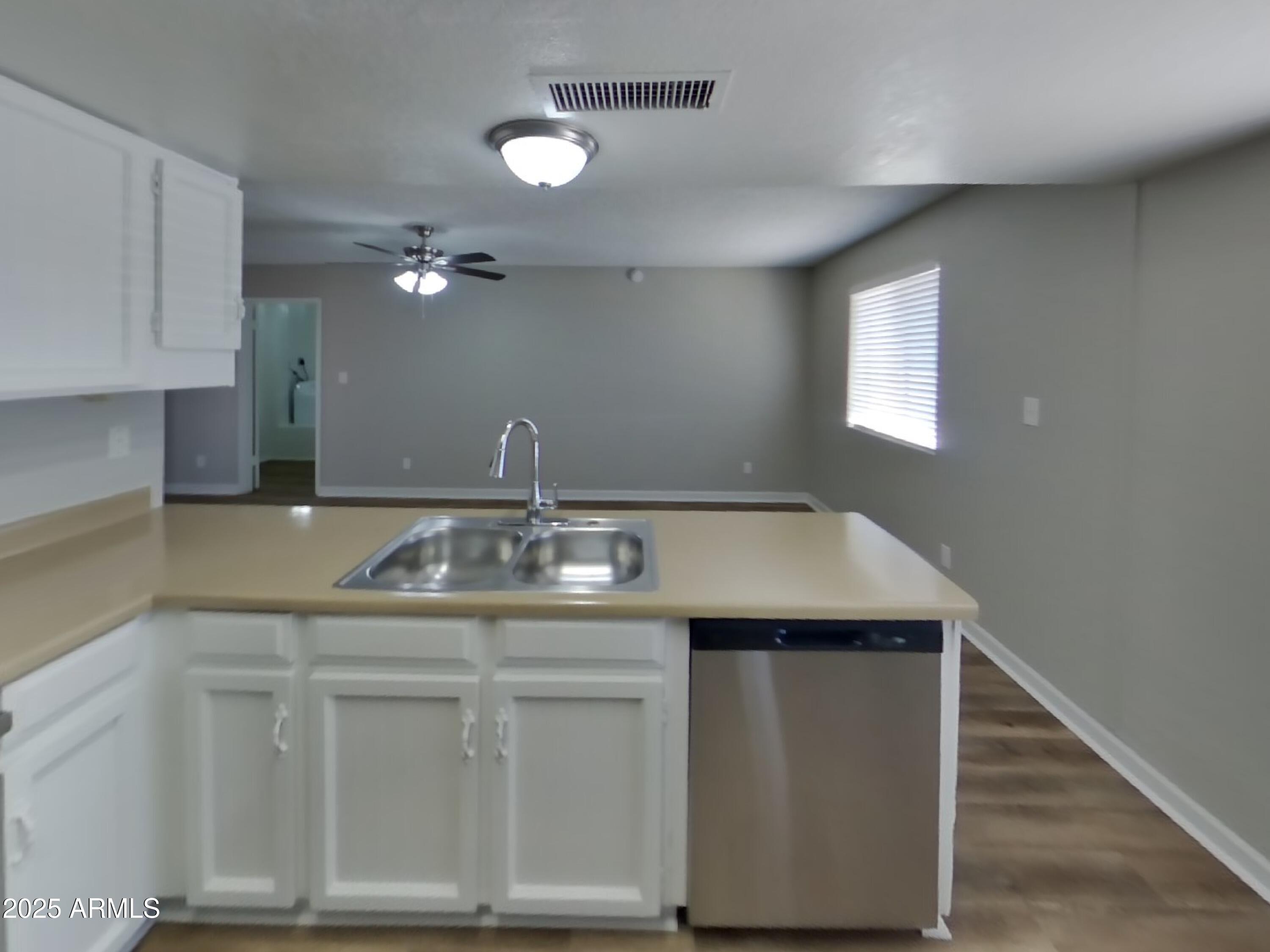 8948 West Heatherbrae Drive Phoenix, AZ 85037 - Photo 8 of 21 a bathroom with a sink and a mirror