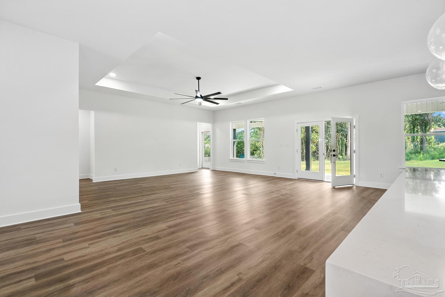 953 Grindstone Lane Cantonment, FL 32533 - Photo 13 of 59 wooden floor in an empty room with a window