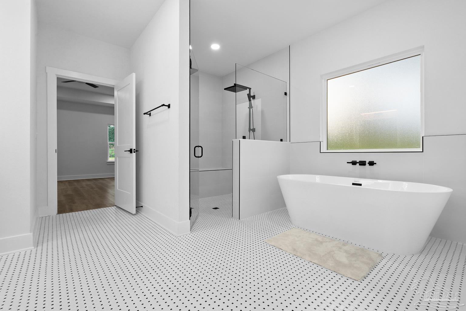 953 Grindstone Lane Cantonment, FL 32533 - Photo 31 of 59 a spacious bathroom with a bathtub and a shower