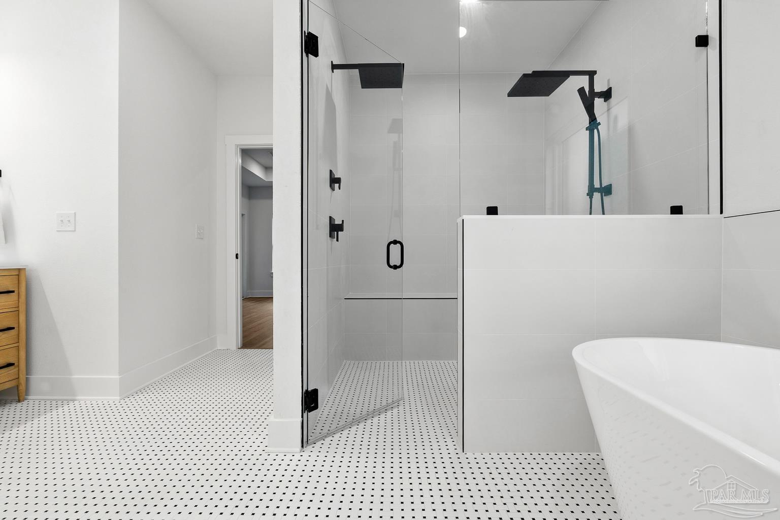 953 Grindstone Lane Cantonment, FL 32533 - Photo 33 of 59 a bathroom with a bathtub and a shower