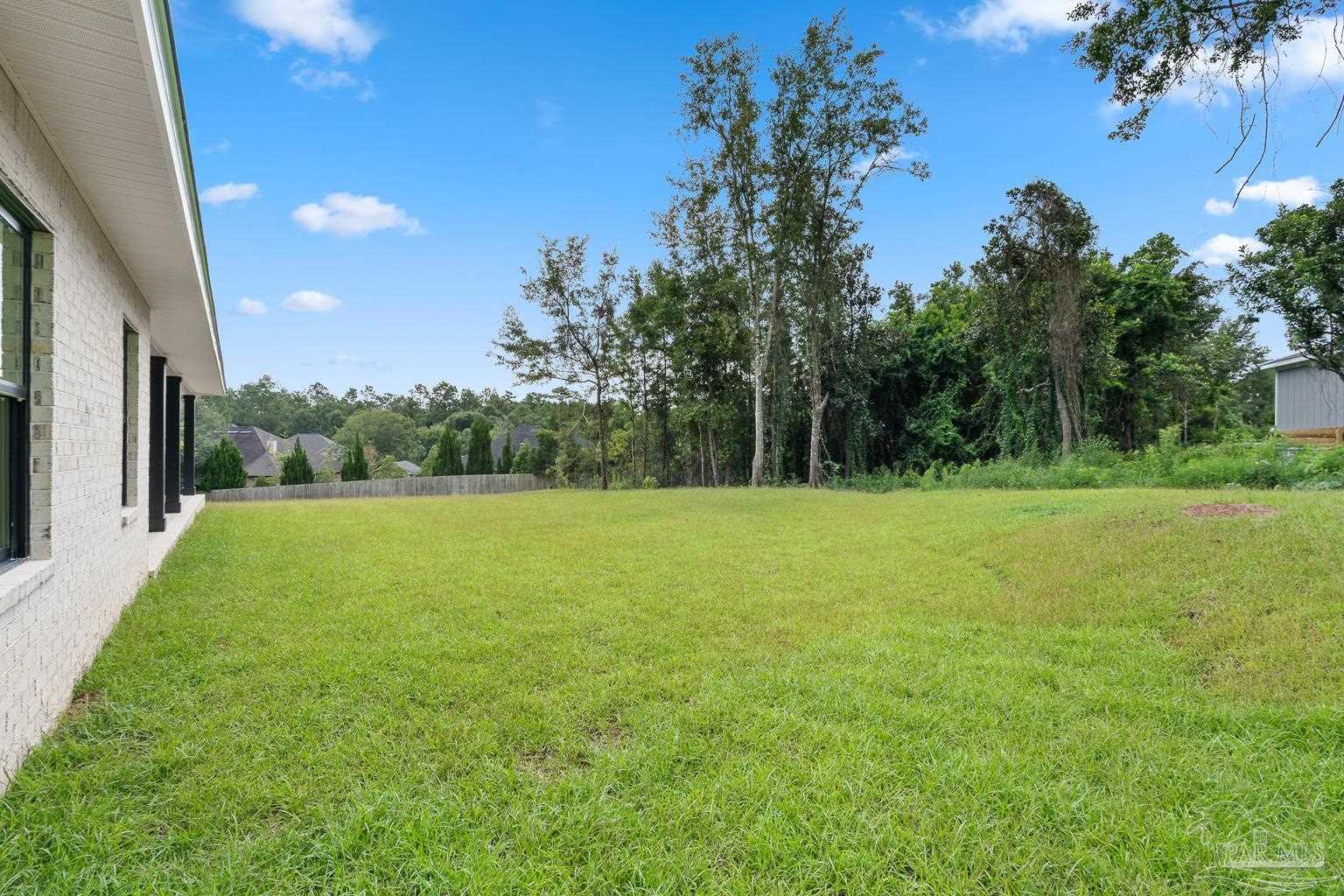 953 Grindstone Lane Cantonment, FL 32533 - Photo 53 of 59 a view of a green field