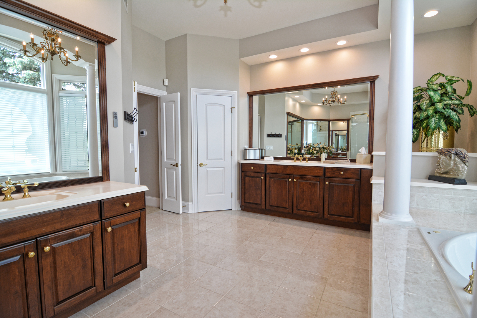 36W580 Stoneleat Road St. Charles, IL 60175 - Photo 21 of 48 a spacious bathroom with a tub sink shower and mirror