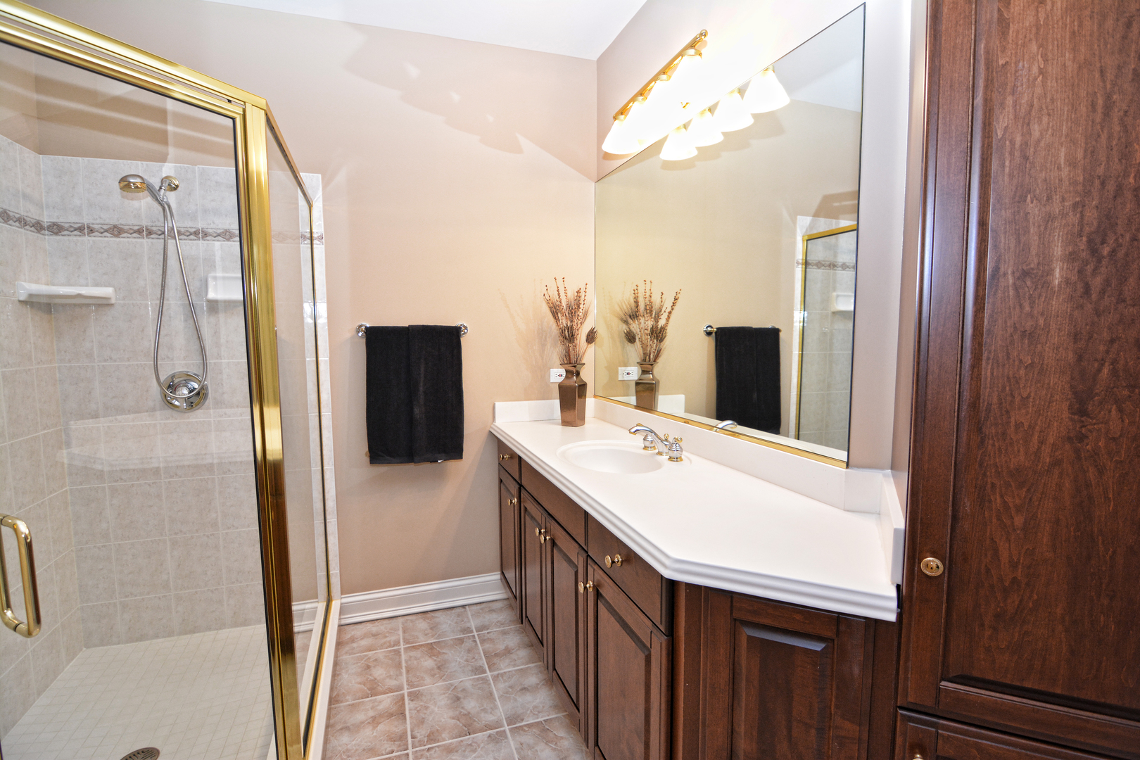 36W580 Stoneleat Road St. Charles, IL 60175 - Photo 29 of 48 a bathroom with a double vanity sink a and a mirror