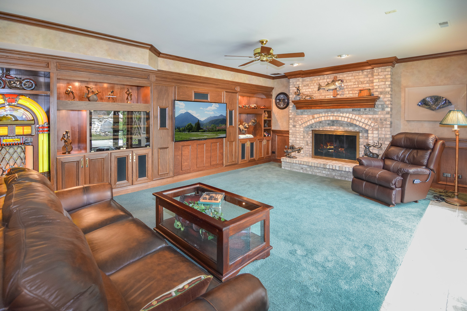 36W580 Stoneleat Road St. Charles, IL 60175 - Photo 33 of 48 a living room with furniture a flat screen tv and a fireplace