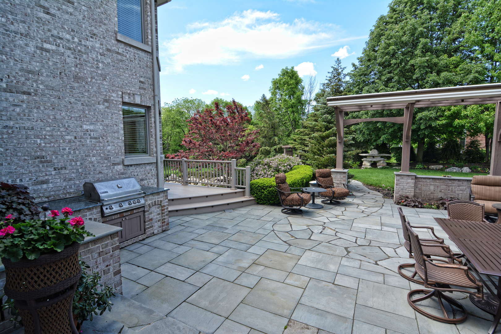 36W580 Stoneleat Road St. Charles, IL 60175 - Photo 40 of 48 a view of a chair and table in backyard of the house