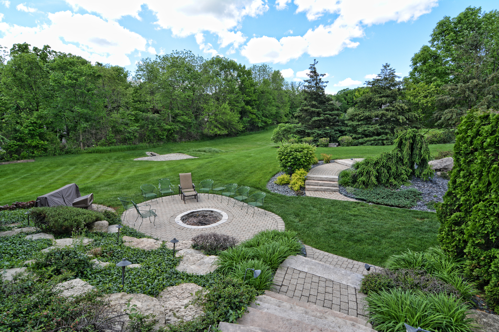 36W580 Stoneleat Road St. Charles, IL 60175 - Photo 42 of 48 a view of a garden with swimming pool and green space