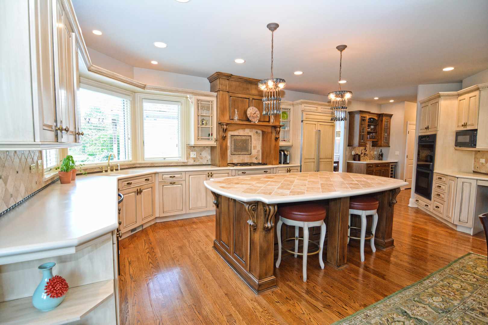 36W580 Stoneleat Road St. Charles, IL 60175 - Photo 10 of 48 a large kitchen with a table and chairs
