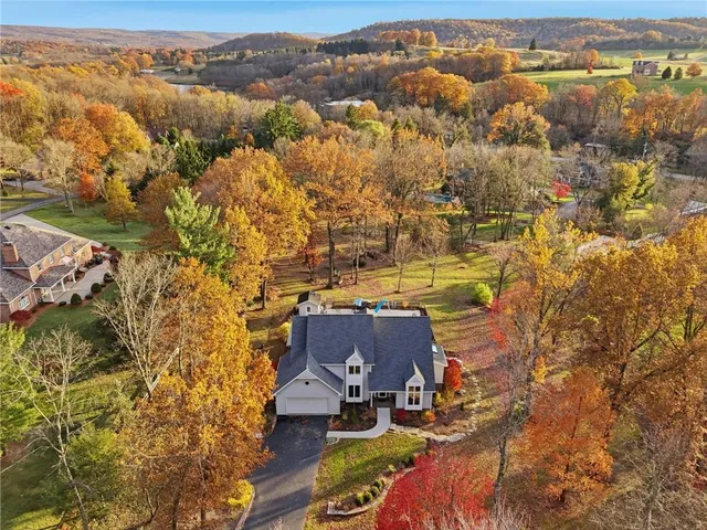 an aerial view of residential houses with outdoor space