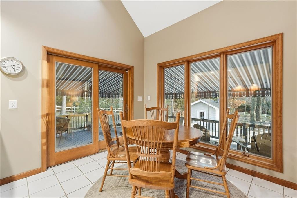 152 Timber Springs Drive Indiana, PA 15701 - Photo 17 of 49 a view of a dining room with furniture and large windows