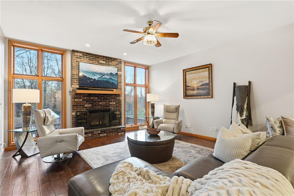 152 Timber Springs Drive Indiana, PA 15701 - Photo 20 of 49 a living room with furniture a fireplace and a large window