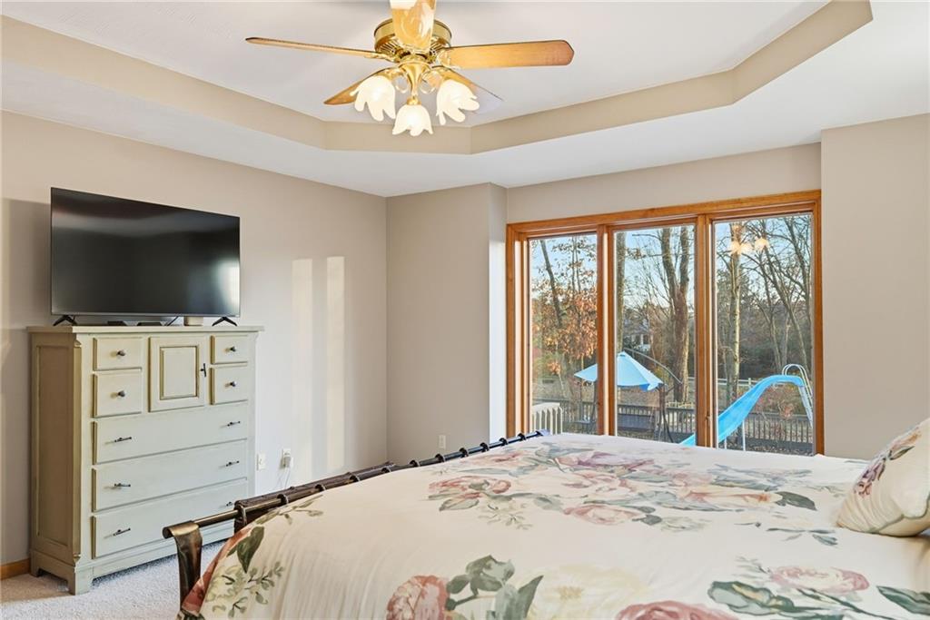 152 Timber Springs Drive Indiana, PA 15701 - Photo 24 of 49 a bedroom with a bed and a flat screen tv