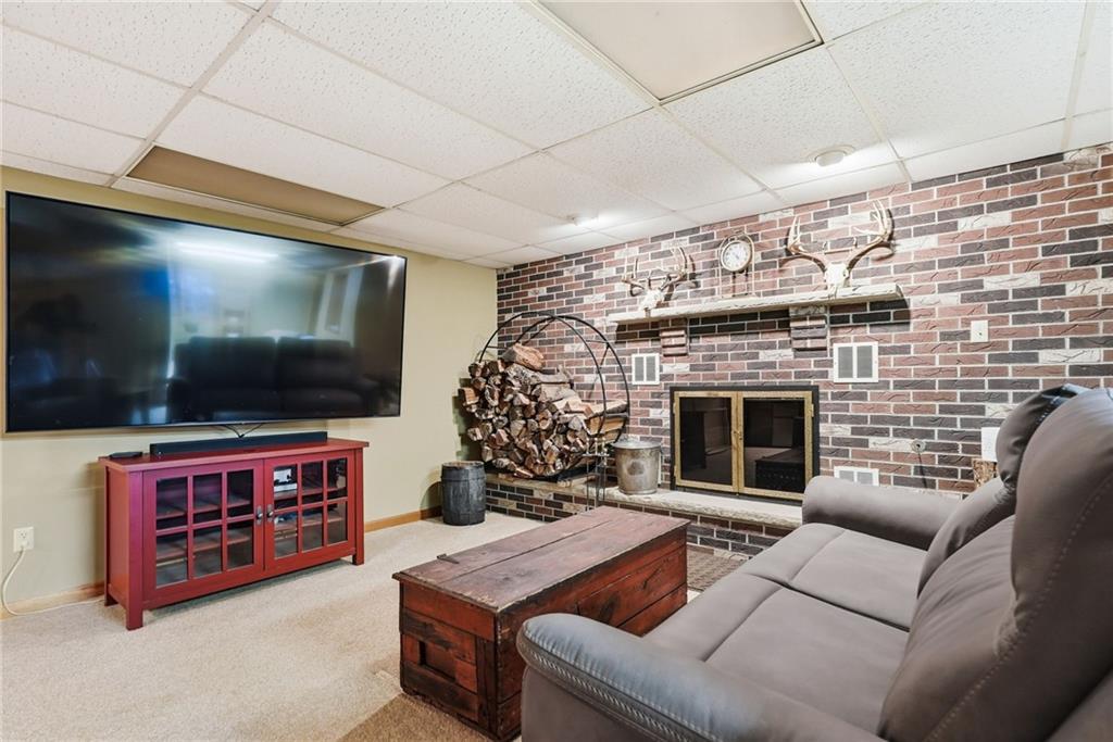 152 Timber Springs Drive Indiana, PA 15701 - Photo 33 of 49 a living room with furniture and a flat screen tv