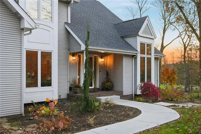 a front view of a house with garden