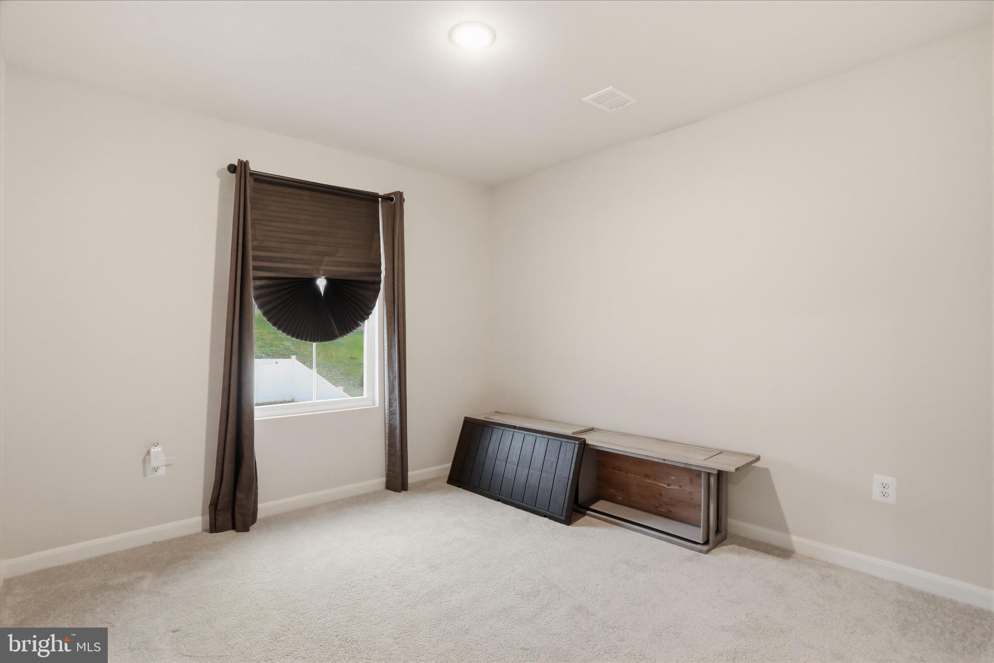 76 Diving Scaup Road Hedgesville, WV 25427 - Photo 23 of 48 a view of a room with a door and wooden floor