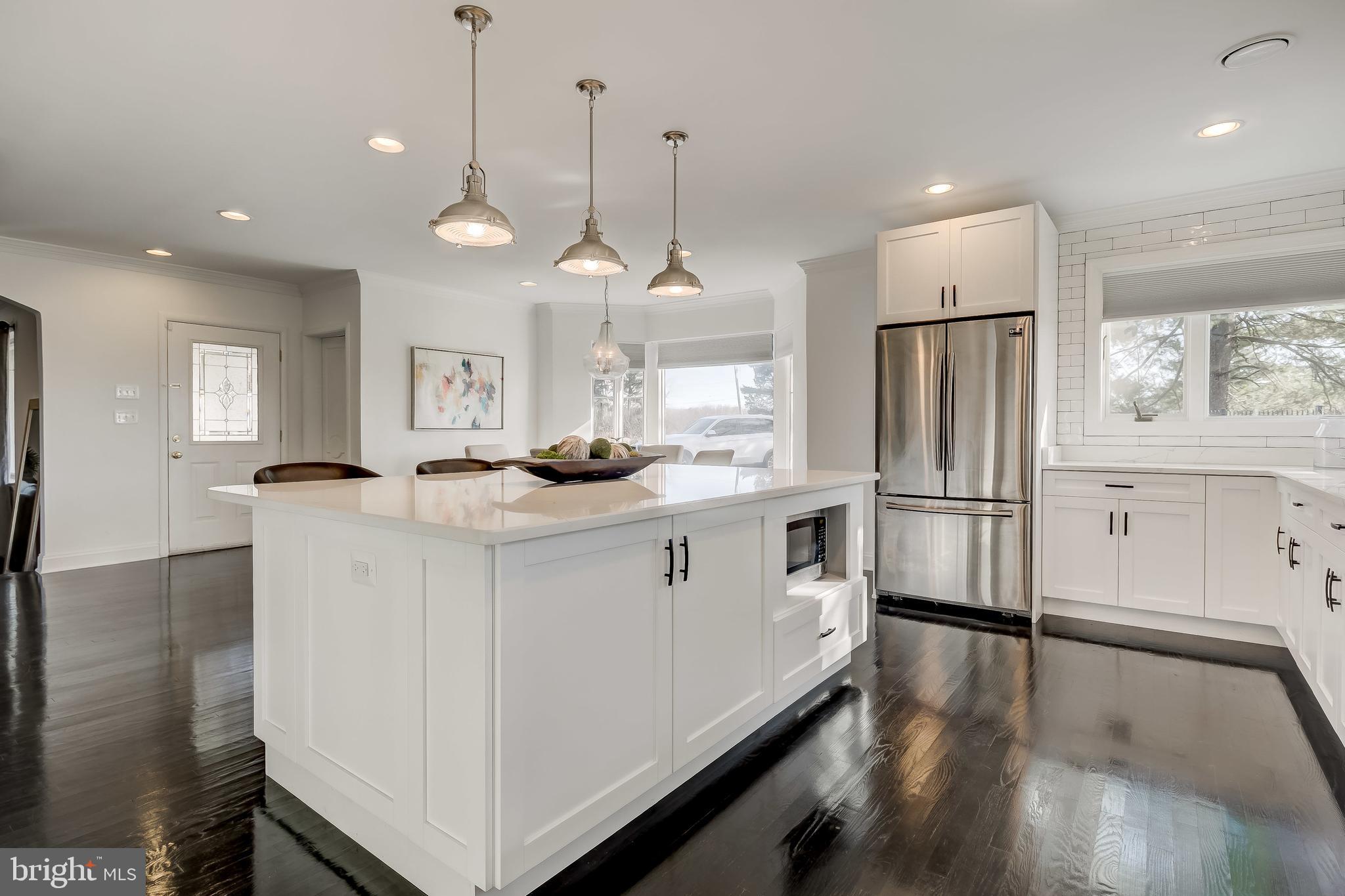 8040 Leishear Road Laurel, MD 20723 - Photo 17 of 66 Stainless steel appliances, dark harwood.