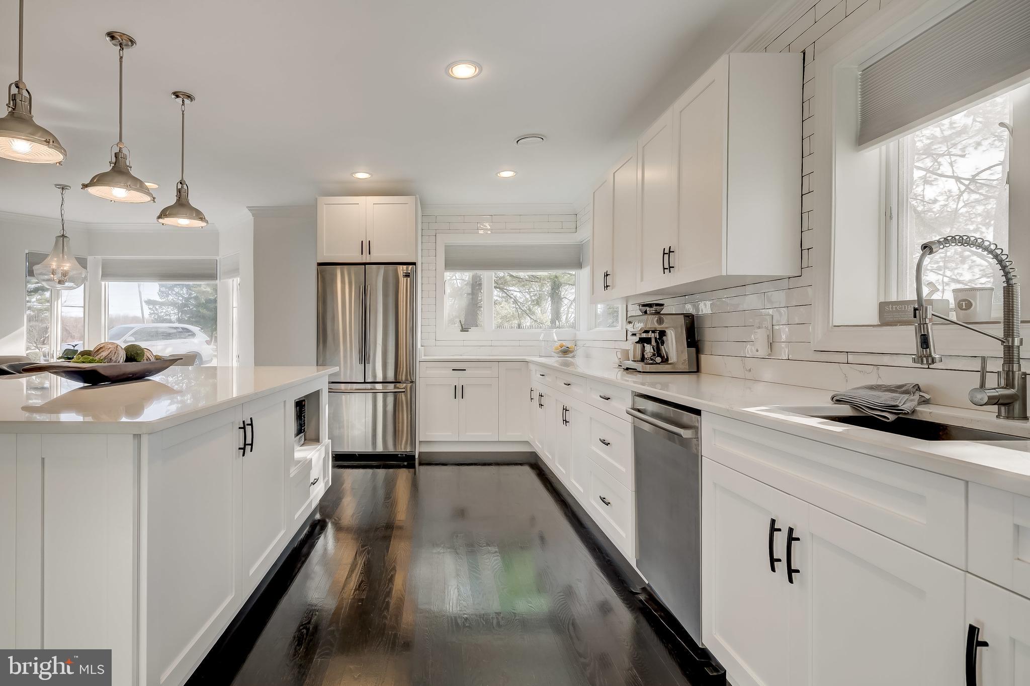 8040 Leishear Road Laurel, MD 20723 - Photo 18 of 66 Stainless steel appliances, dark harwood.