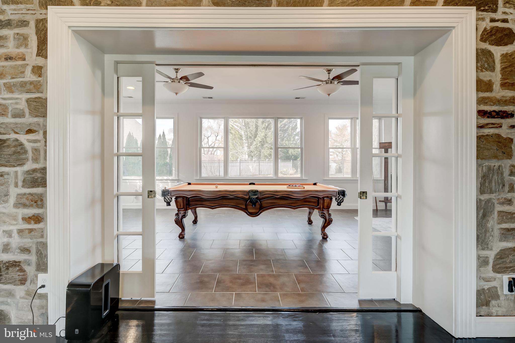 8040 Leishear Road Laurel, MD 20723 - Photo 27 of 66 Game room, double sliding doors.