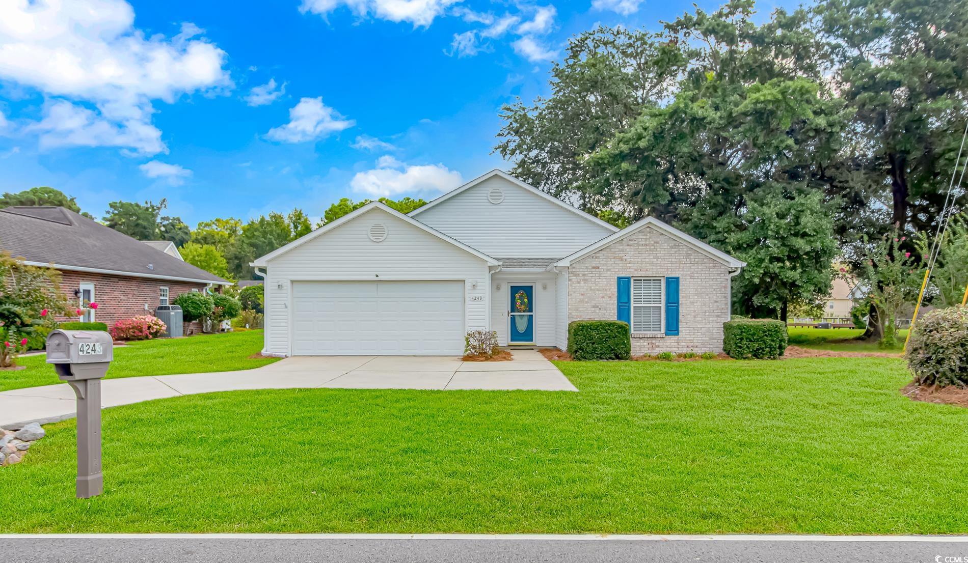 4243 Horseshoe Road North Little River, SC 29566 - Photo 1 of 26 Ranch-style home featuring a front yard and a gara