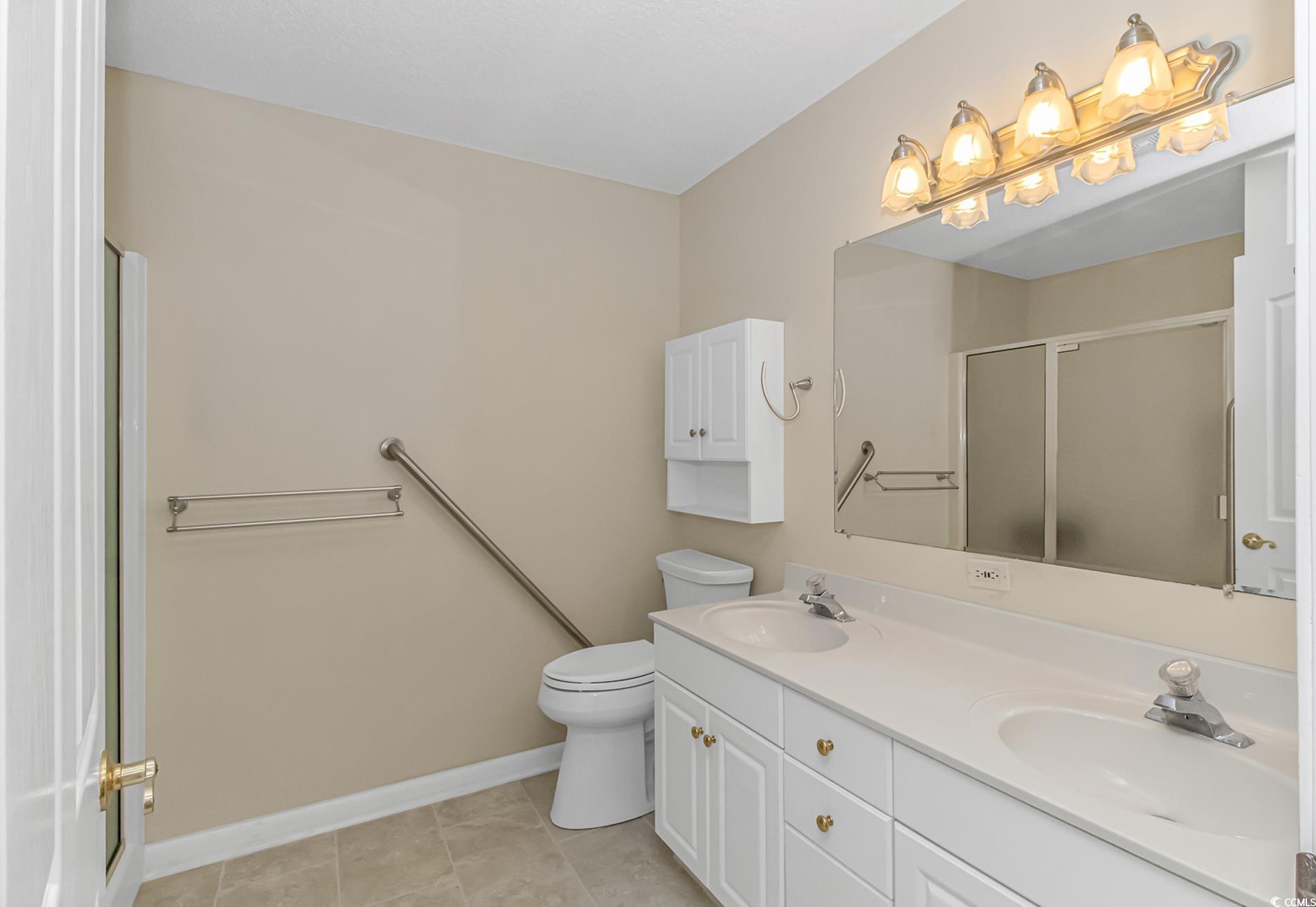 4243 Horseshoe Road North Little River, SC 29566 - Photo 15 of 26 Bathroom with vanity, toilet, a shower with shower