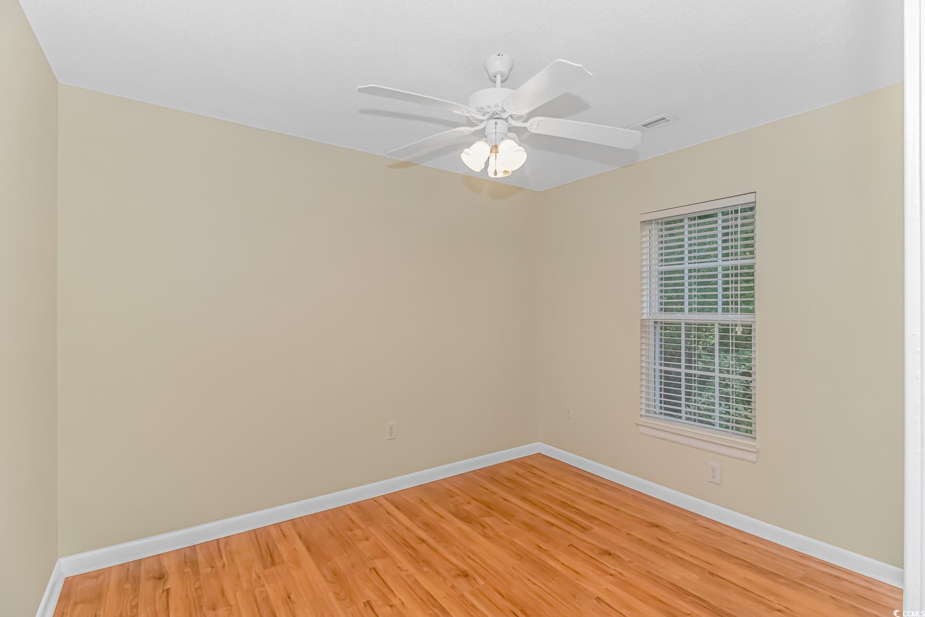 4243 Horseshoe Road North Little River, SC 29566 - Photo 17 of 26 Empty room featuring hardwood / wood-style floors