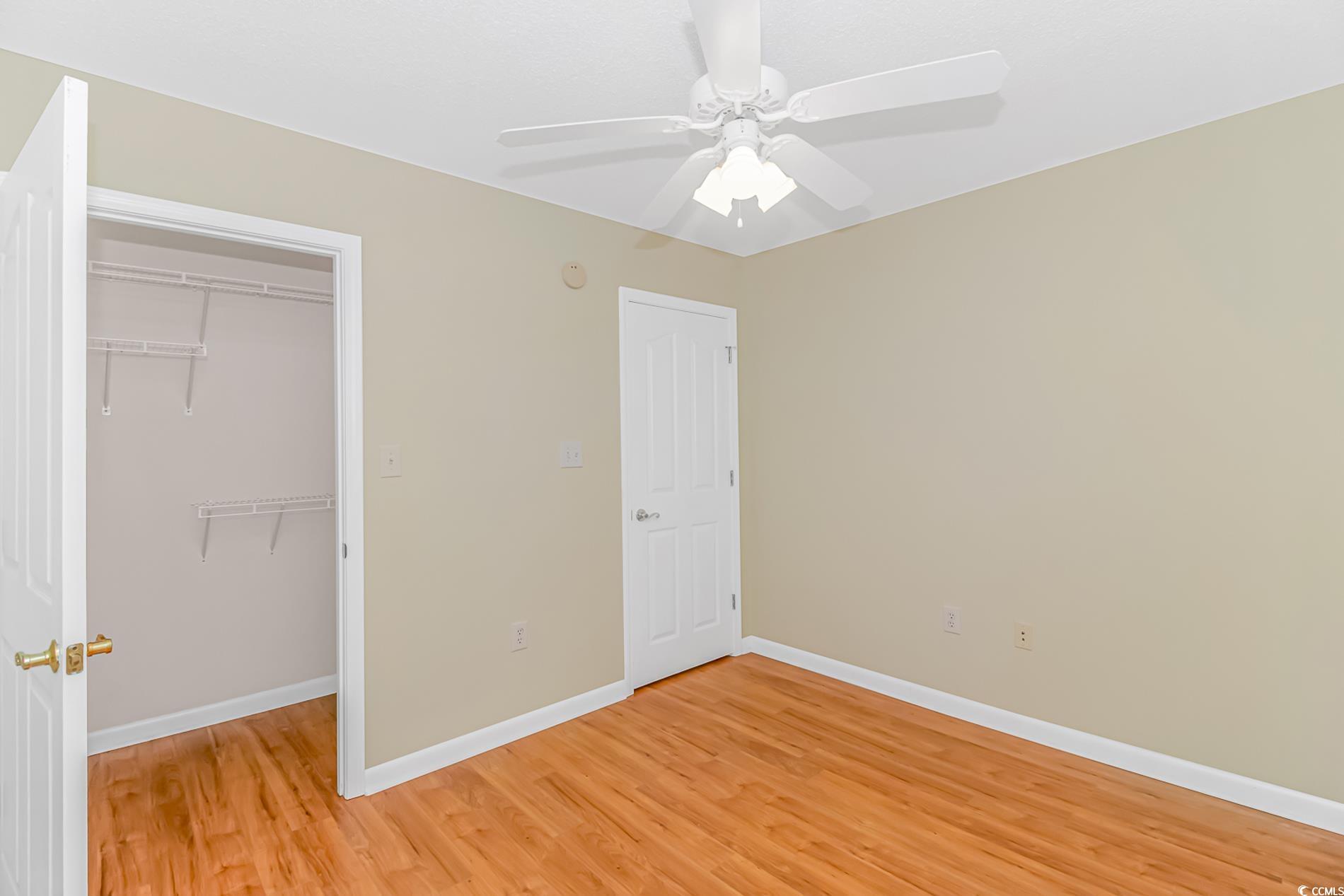 4243 Horseshoe Road North Little River, SC 29566 - Photo 18 of 26 Unfurnished bedroom featuring hardwood / wood-styl