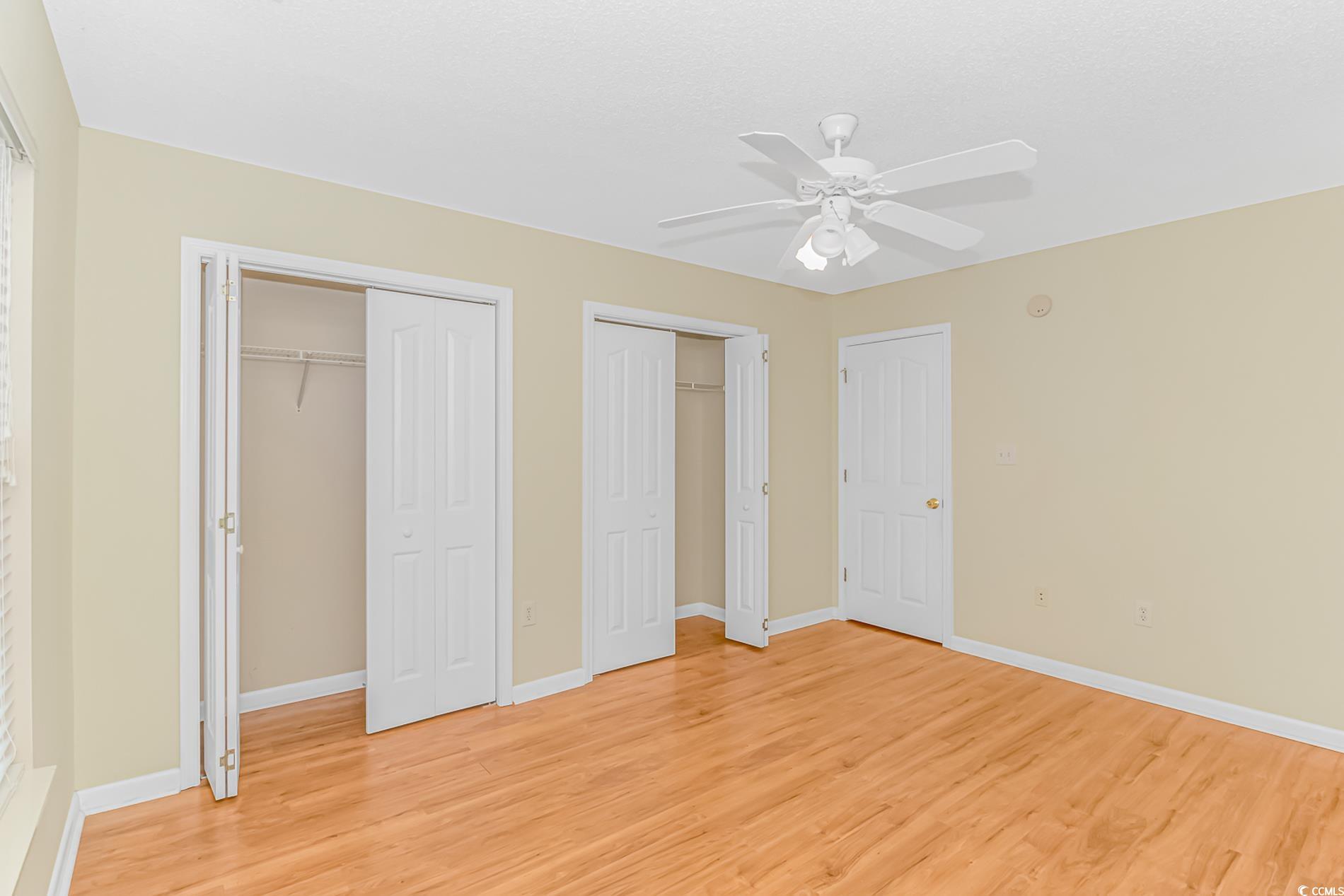 4243 Horseshoe Road North Little River, SC 29566 - Photo 21 of 26 Unfurnished bedroom featuring multiple closets, ce