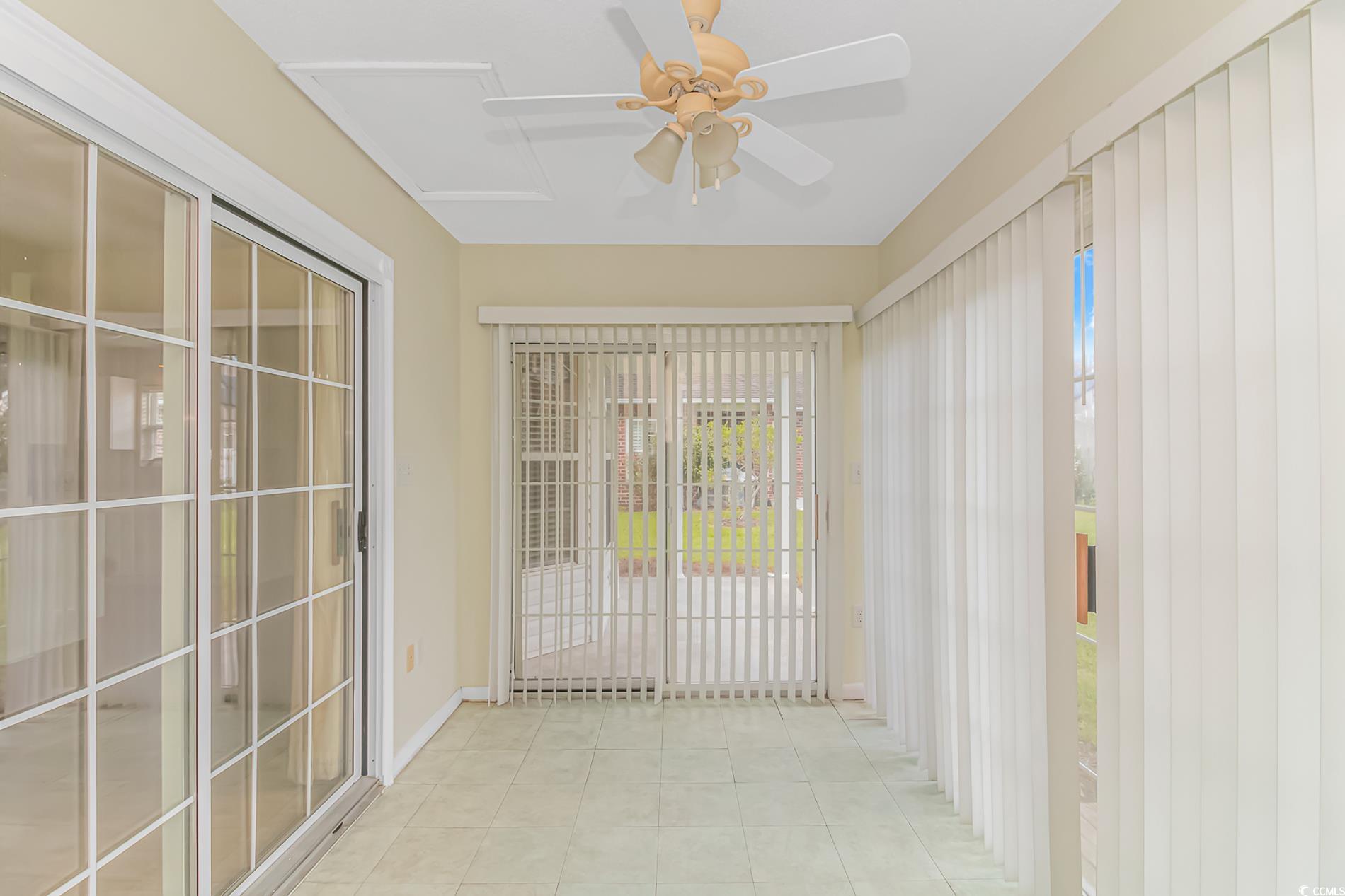 4243 Horseshoe Road North Little River, SC 29566 - Photo 22 of 26 Unfurnished sunroom with ceiling fan