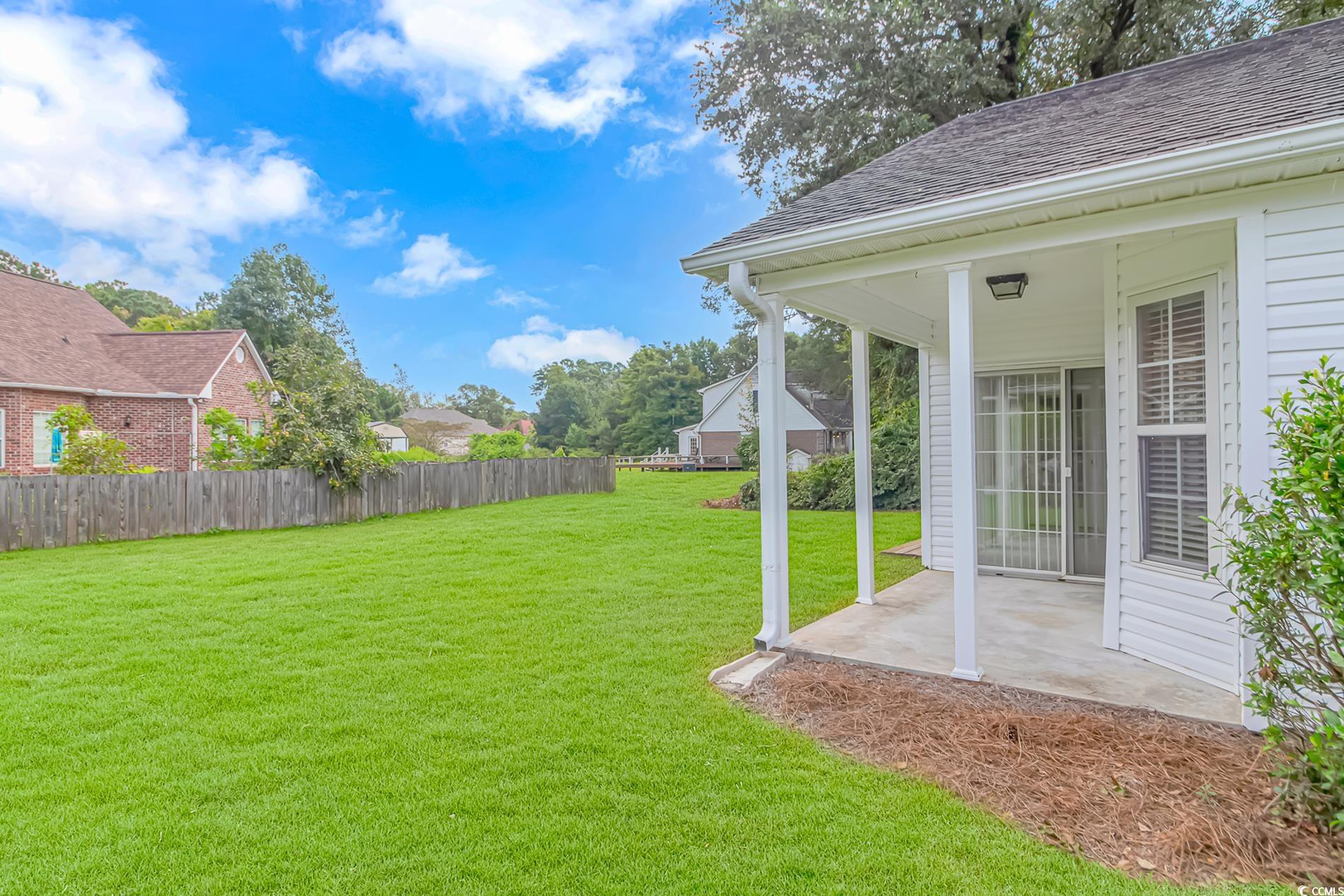 4243 Horseshoe Road North Little River, SC 29566 - Photo 24 of 26 View of yard featuring a patio area