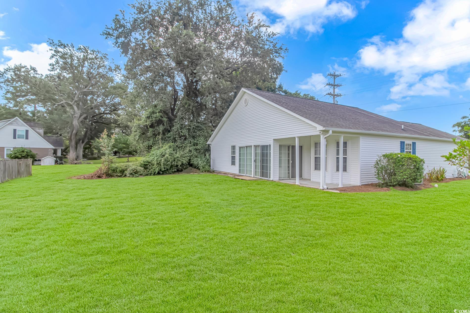 4243 Horseshoe Road North Little River, SC 29566 - Photo 25 of 26 View of property exterior with a yard