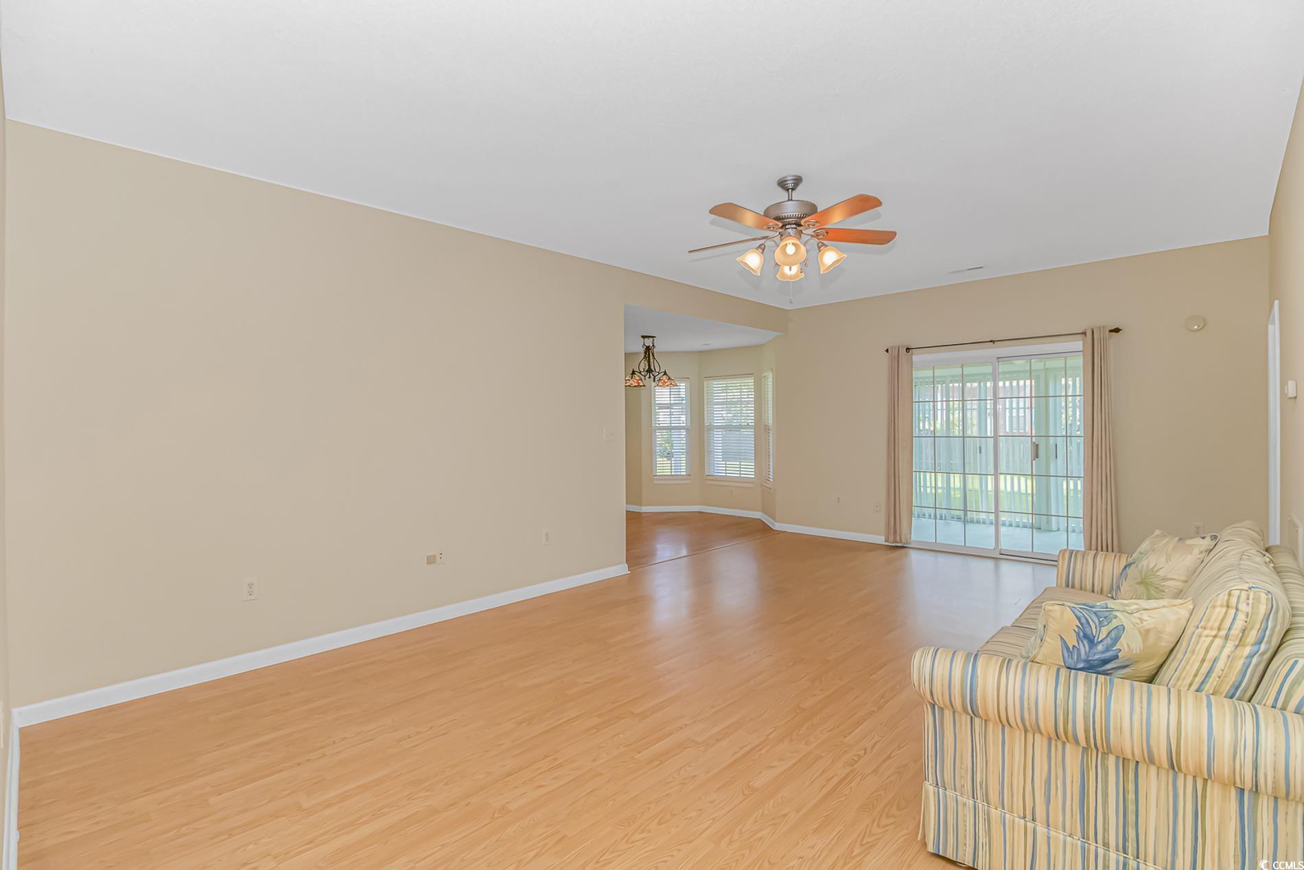 4243 Horseshoe Road North Little River, SC 29566 - Photo 5 of 26 Unfurnished living room featuring light hardwood /