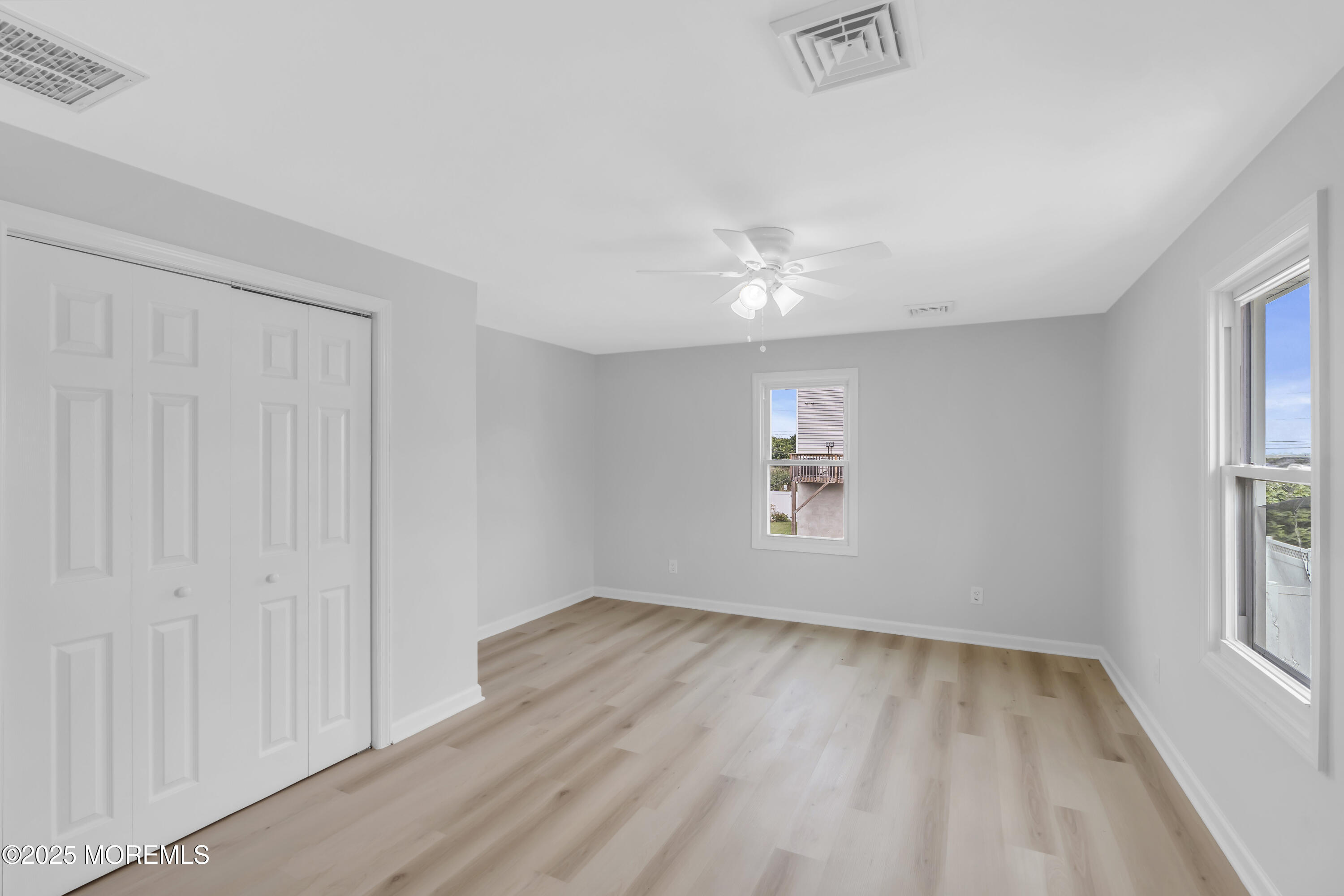 825 Lorillard Avenue Union Beach, NJ 07735 - Photo 12 of 22 wooden floor in an empty room with a window