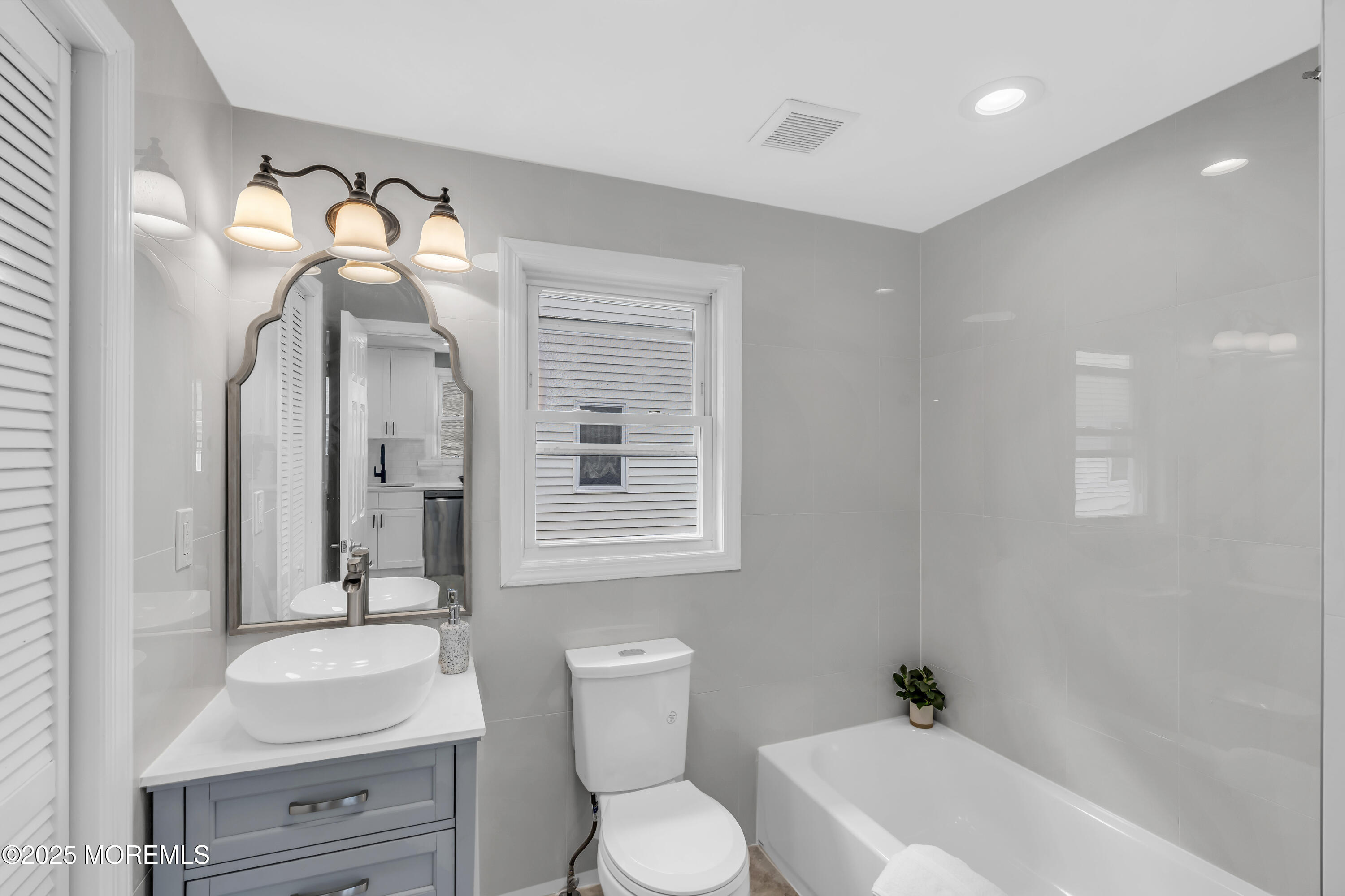825 Lorillard Avenue Union Beach, NJ 07735 - Photo 14 of 22 a bathroom with a toilet sink and mirror