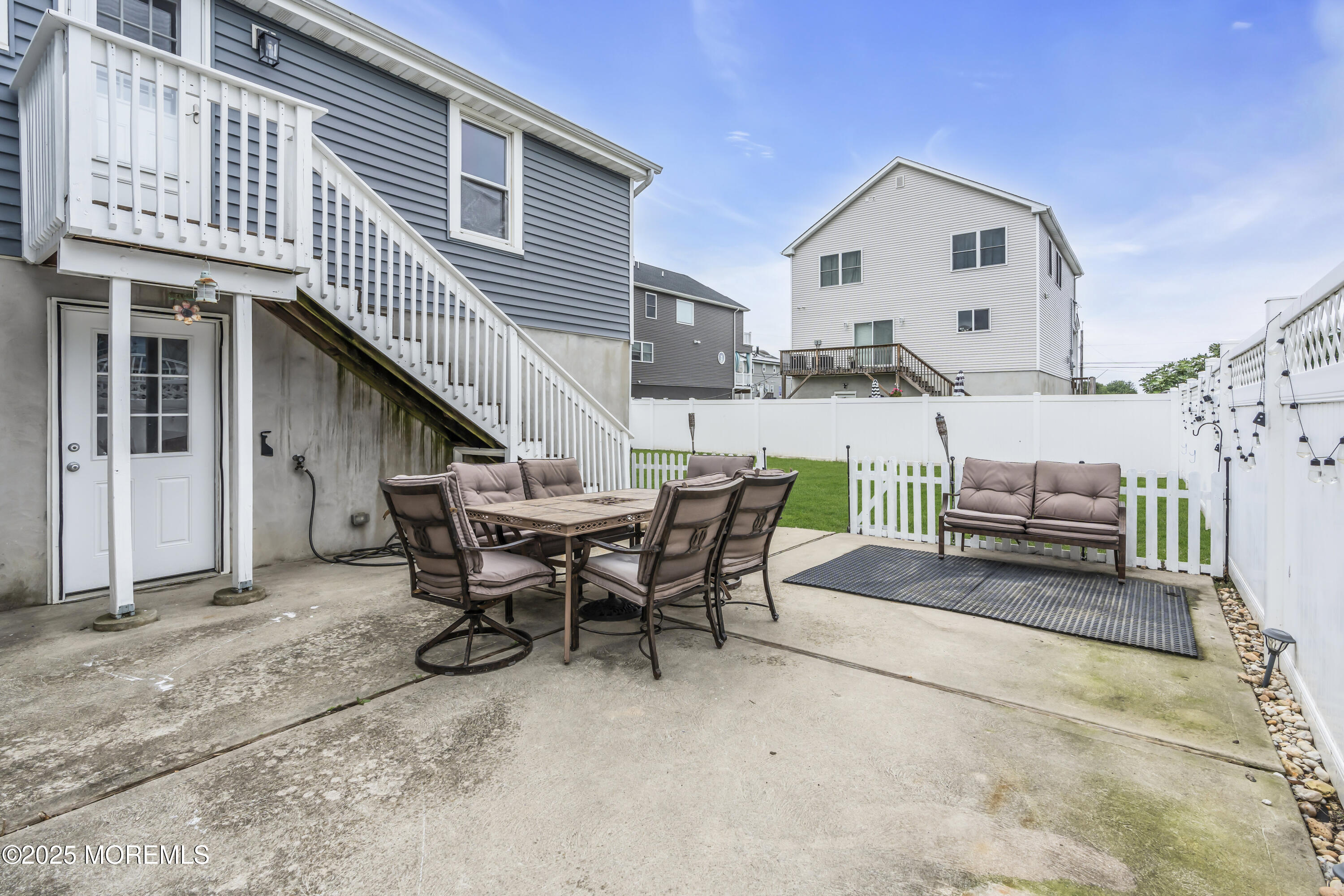 825 Lorillard Avenue Union Beach, NJ 07735 - Photo 16 of 22 a view of a house with backyard and sitting area