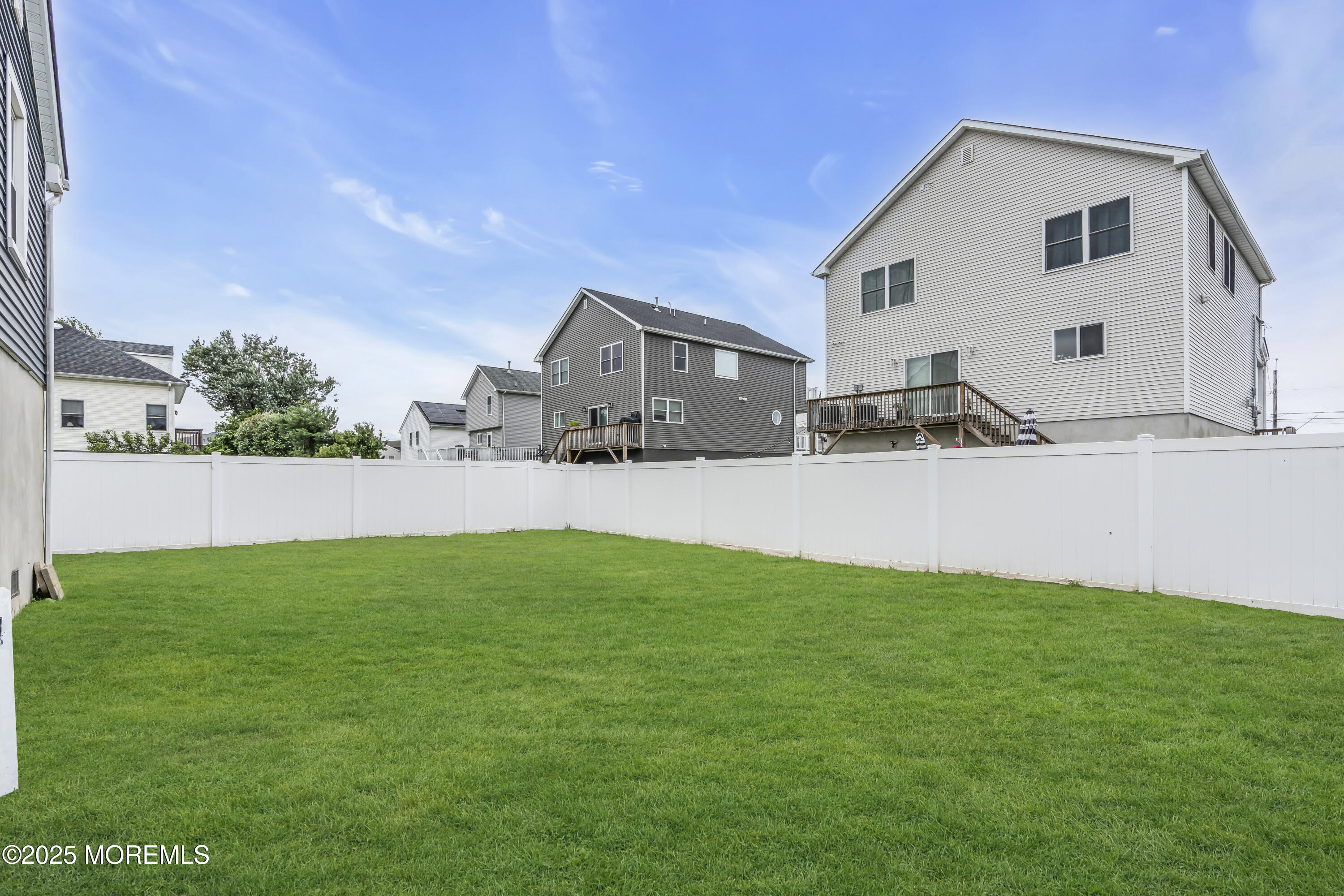 825 Lorillard Avenue Union Beach, NJ 07735 - Photo 17 of 22 a view of a house with backyard and a tree