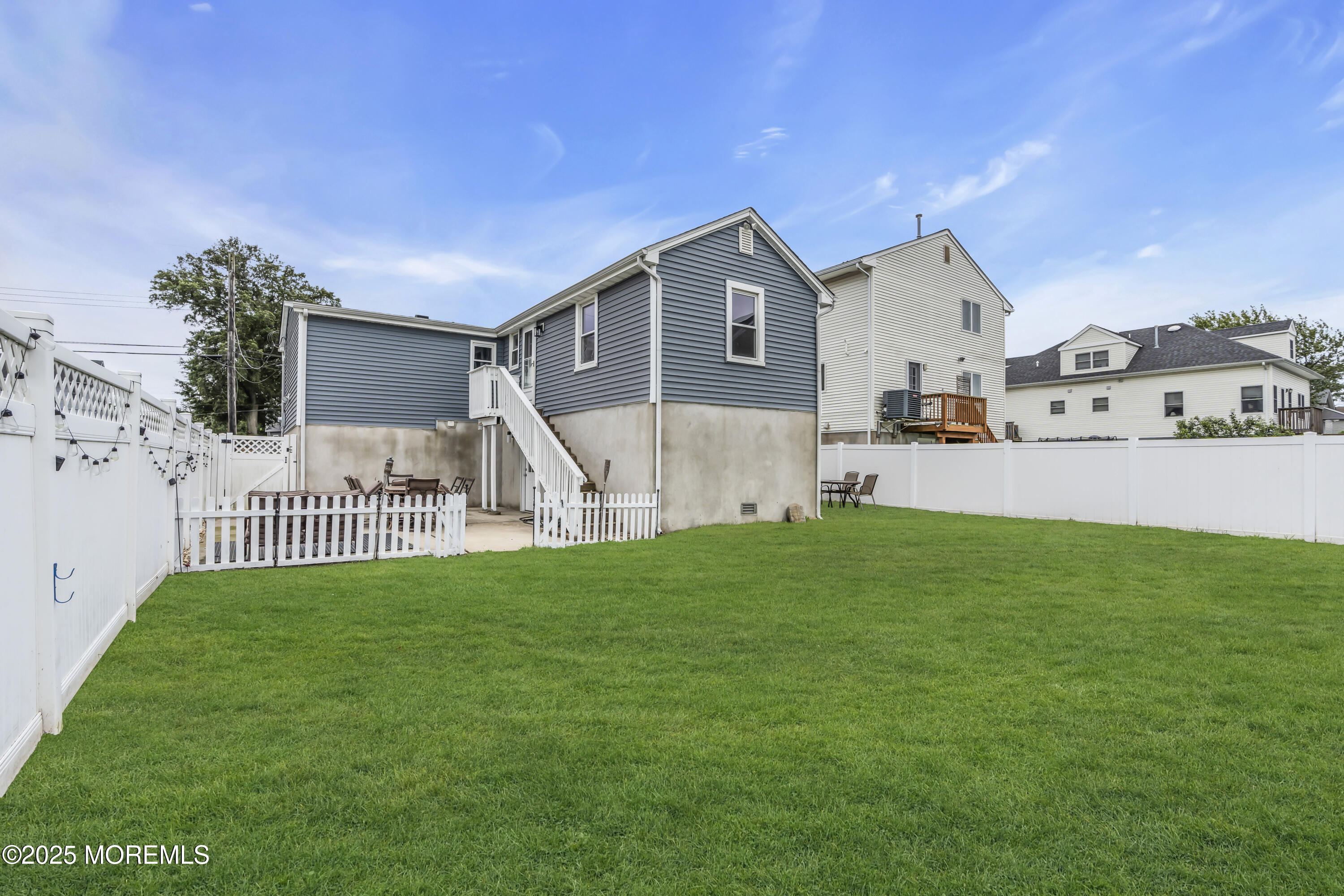 825 Lorillard Avenue Union Beach, NJ 07735 - Photo 18 of 22 a view of a house with a yard and porch