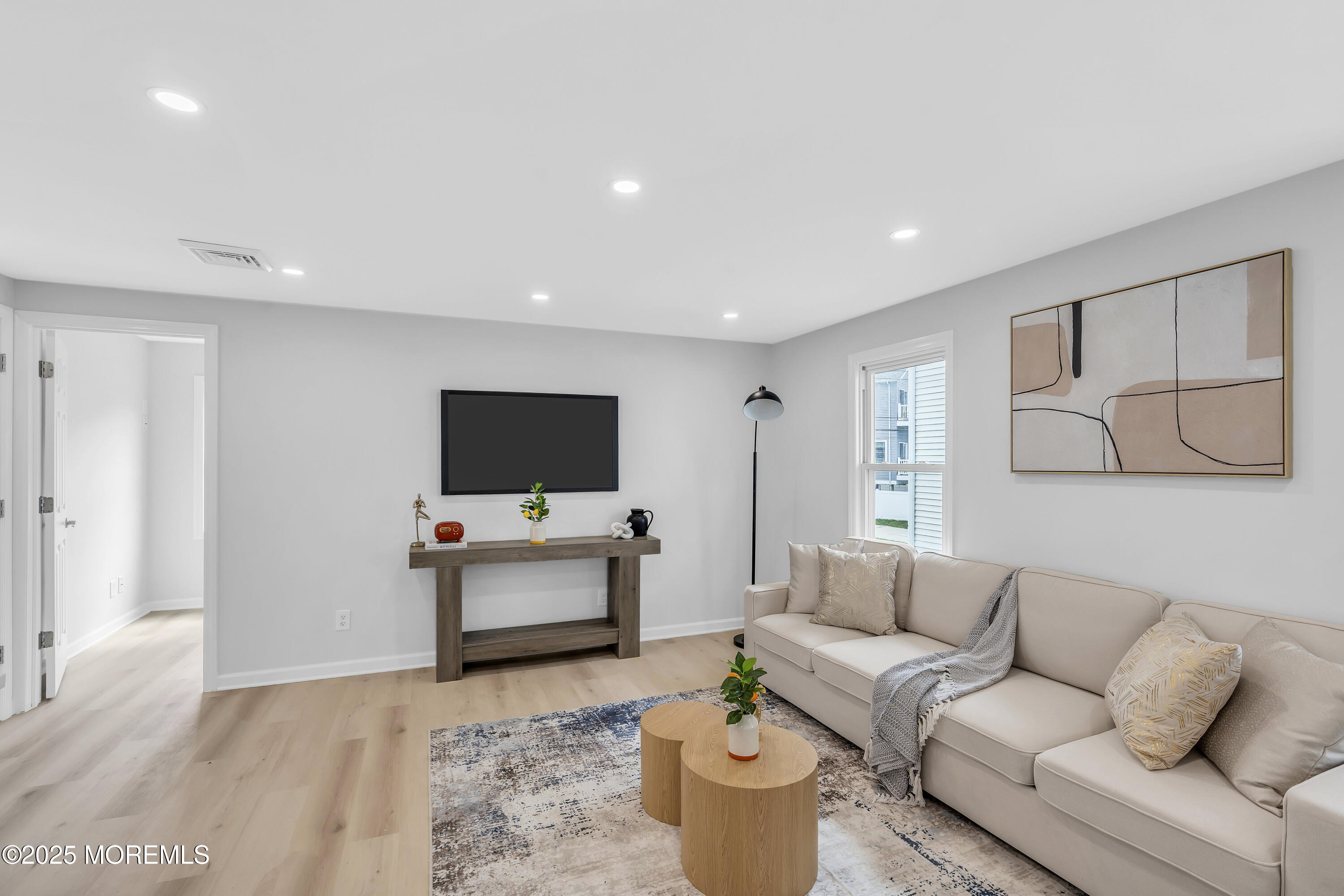 825 Lorillard Avenue Union Beach, NJ 07735 - Photo 4 of 22 a living room with furniture and a flat screen tv