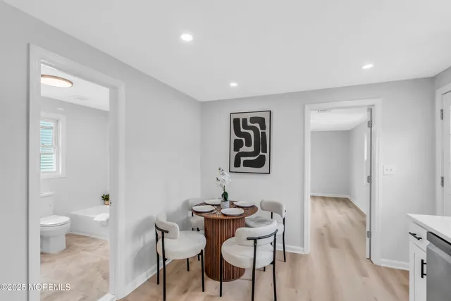 a view of a livingroom with furniture and wooden floor