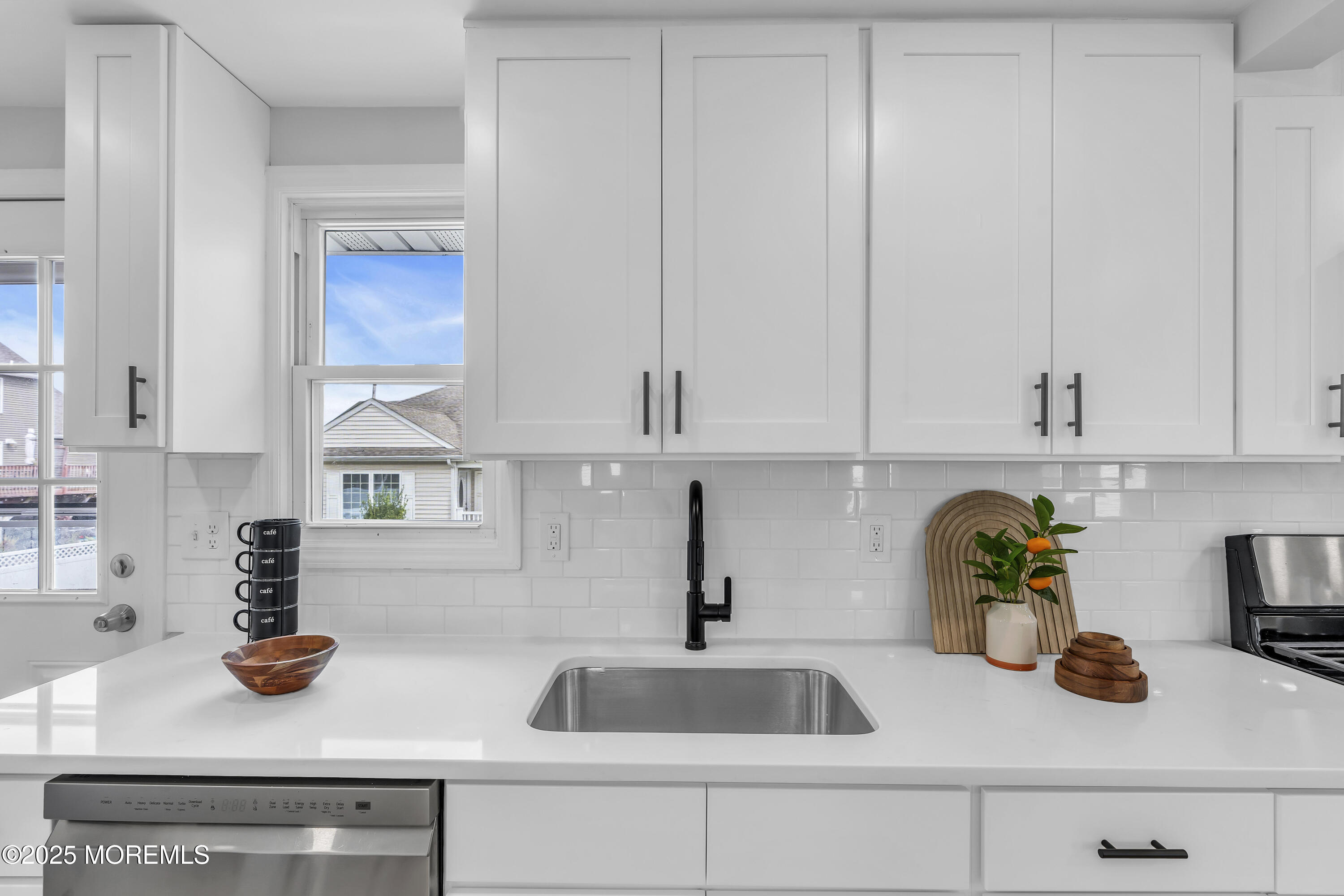 825 Lorillard Avenue Union Beach, NJ 07735 - Photo 8 of 22 a kitchen with a sink and cabinets