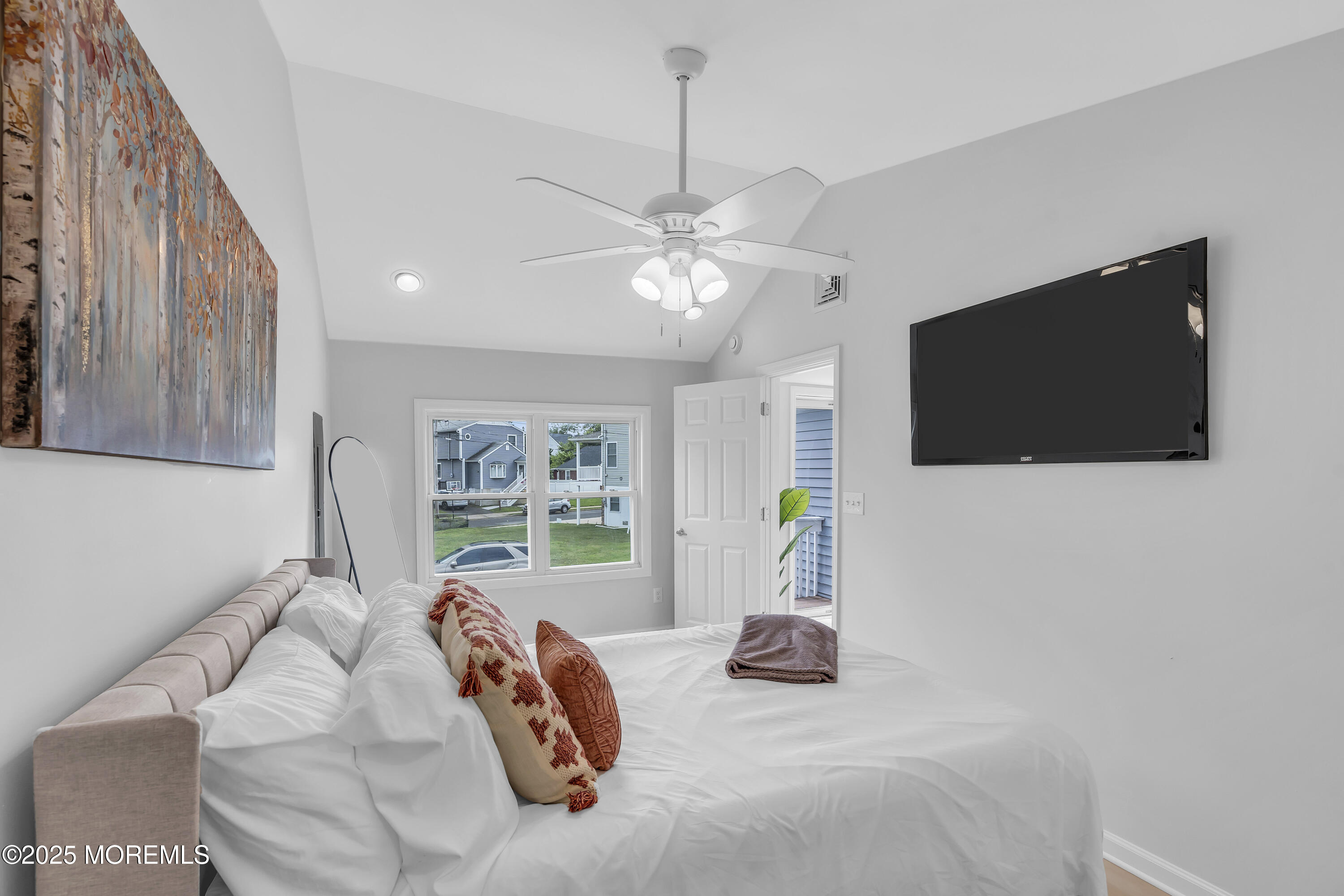 825 Lorillard Avenue Union Beach, NJ 07735 - Photo 10 of 22 a living room with furniture and a flat screen tv
