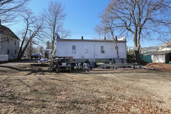a large house with a large tree in front of it