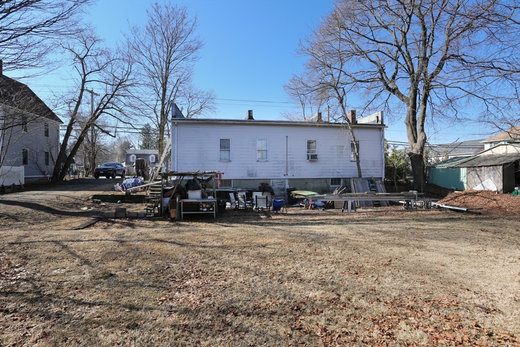 62 Waltham Street Maynard, MA 01754 - Photo 6 of 8 a front view of a house with yard and trees