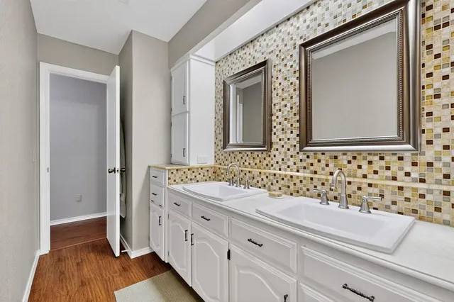 a bathroom with a sink a toilet and a bathtub