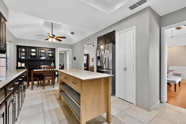 a large kitchen with a lot of counter top space