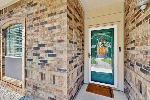 a front view of a house with swimming pool having outdoor seating