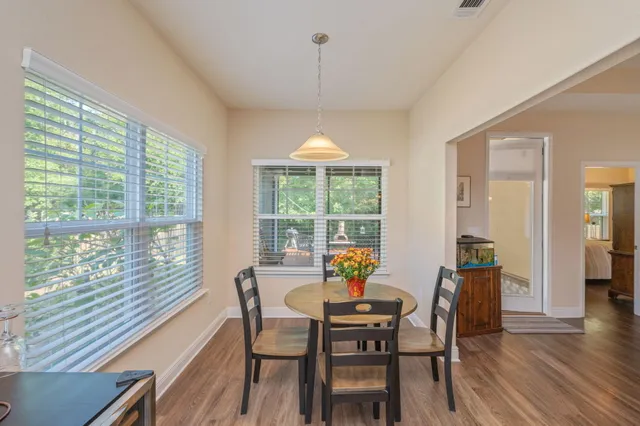 a view of a dining room with furniture window and outside view