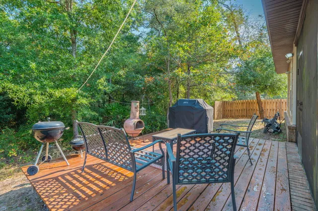 a view of a chairs and table on the wooden floor