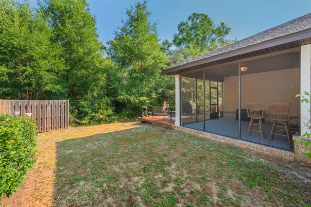 a view of a backyard with plants and garden